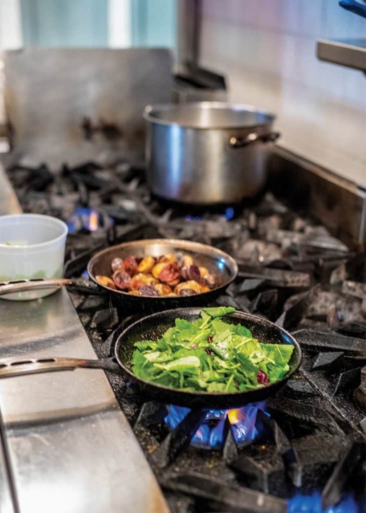 Once you cook the shallot, garlic and chile flakes with oil, cook the kale a little at a time until tender.